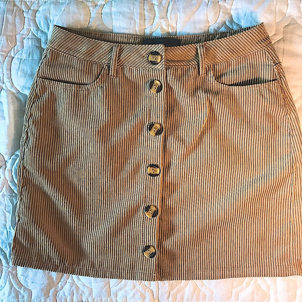 Faux suede button skirt.